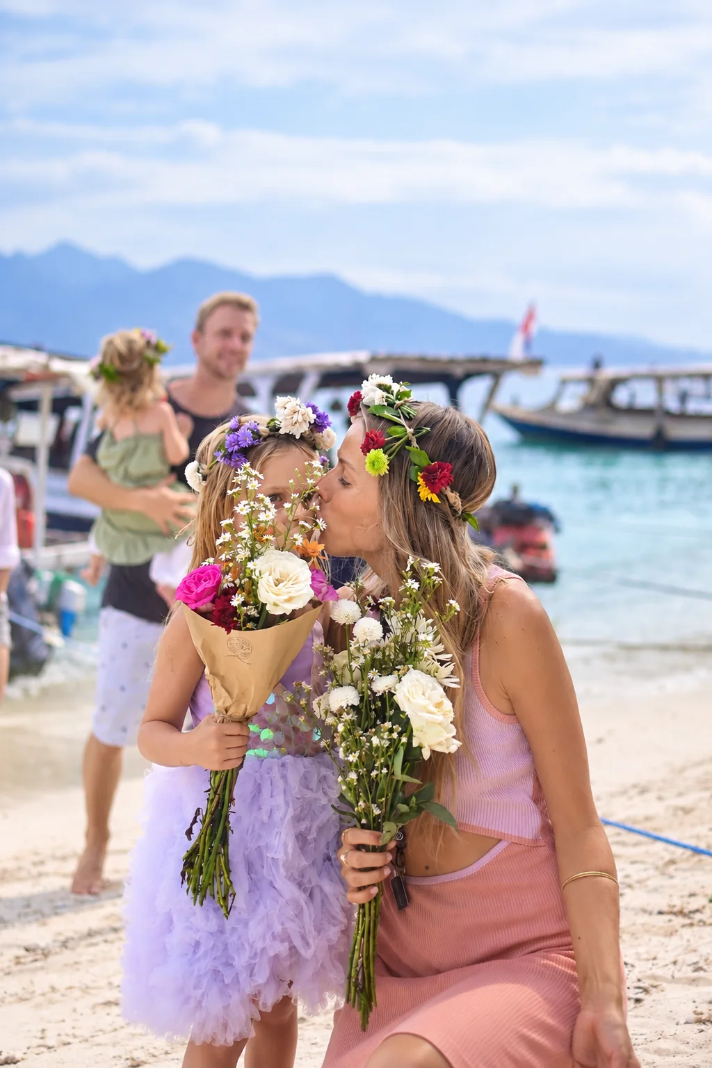 Mother and child with fresh Island Bloom flowers on Gili Air